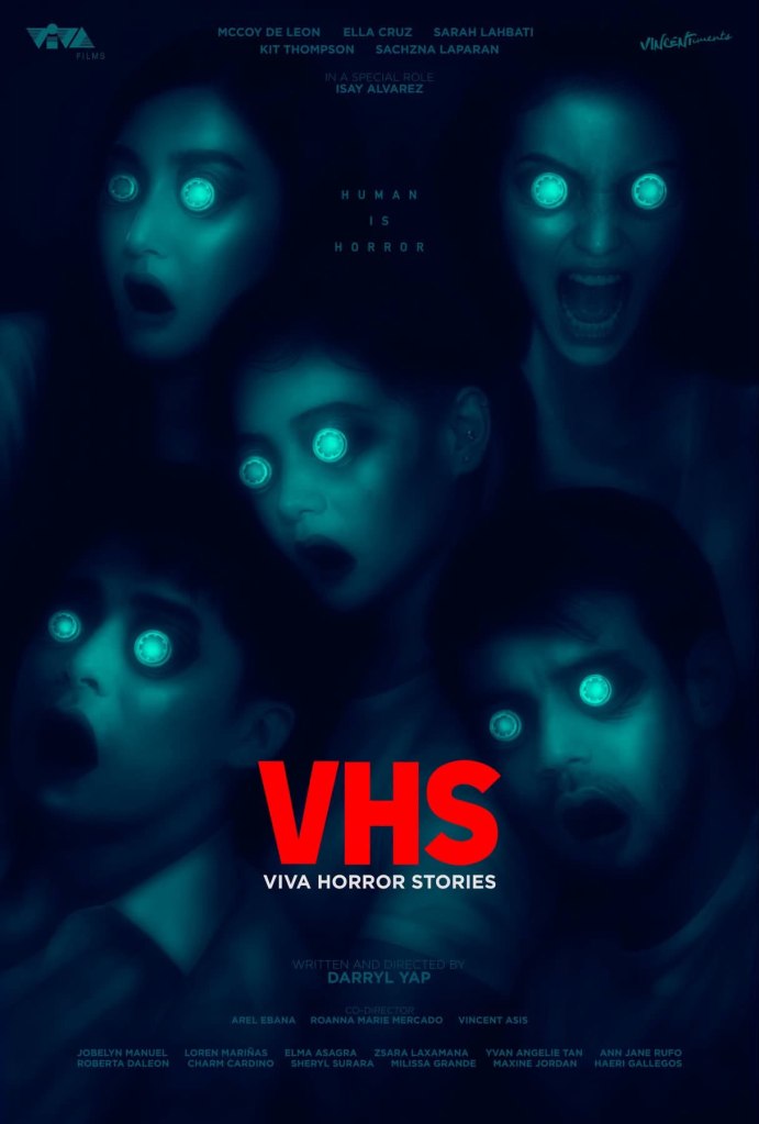 A dark and eerie movie poster for 'VHS: Viva Horror Stories' featuring terrified characters with glowing blue eyes and open mouths, set against a shadowy background.
